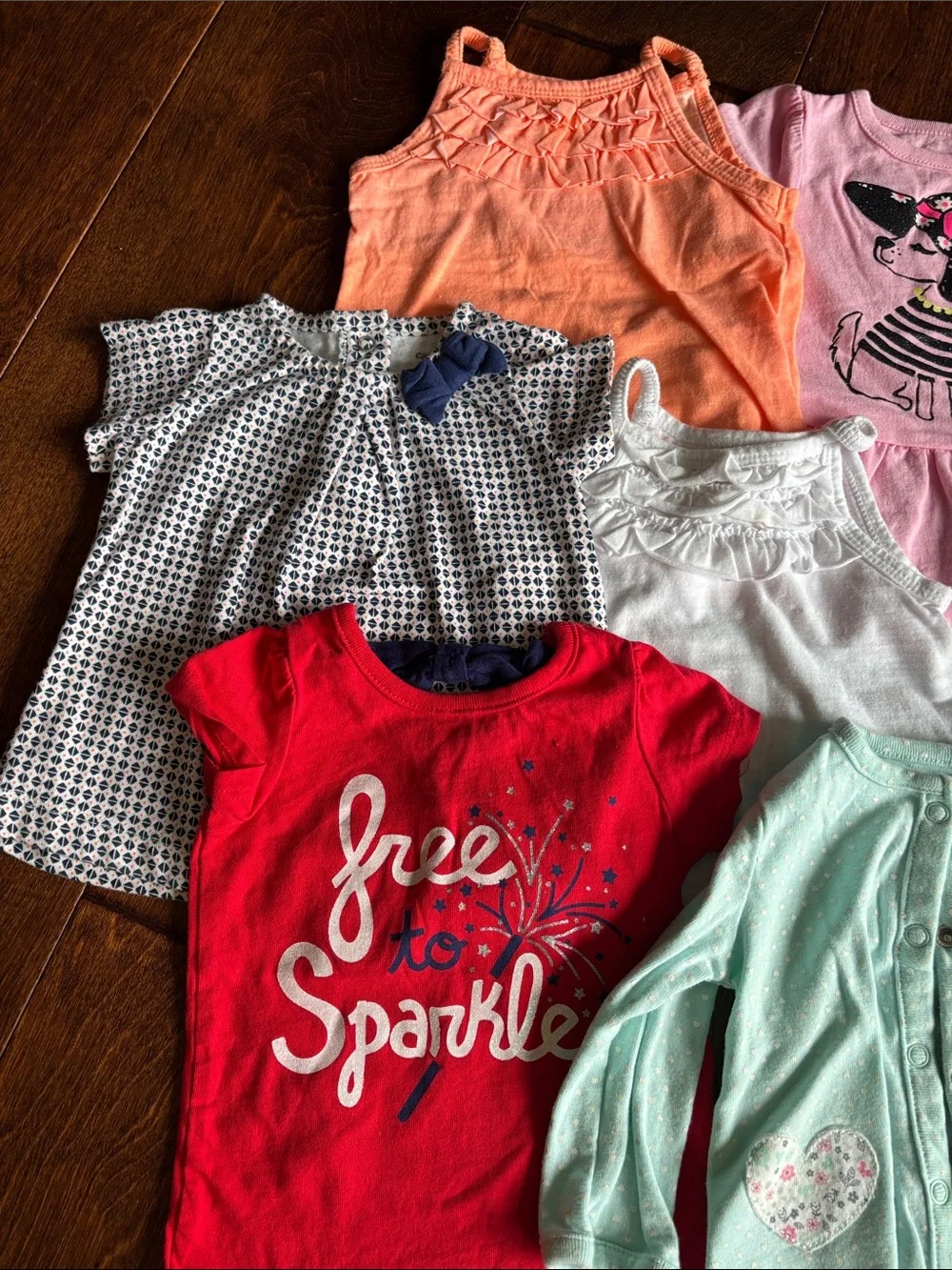 6 tops and 3 rompers with various designs